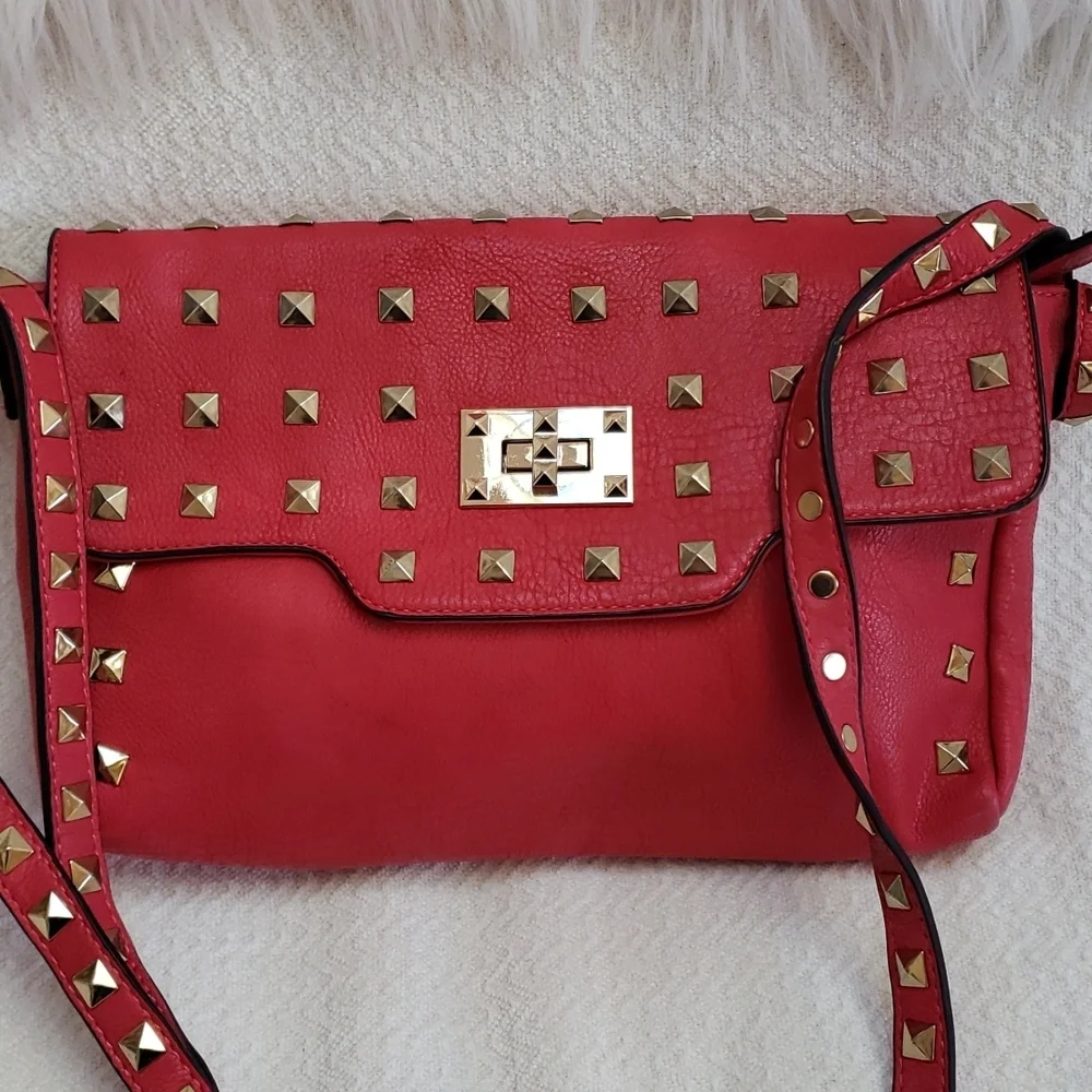 RED studded-embellished lipstick red vegan leather shoulder bag
